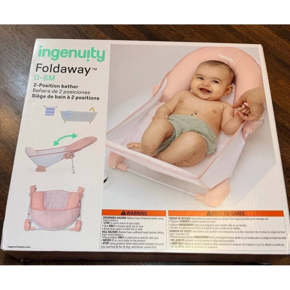 New in box foldaway 2 position bather. Pink. For 0-6 months.